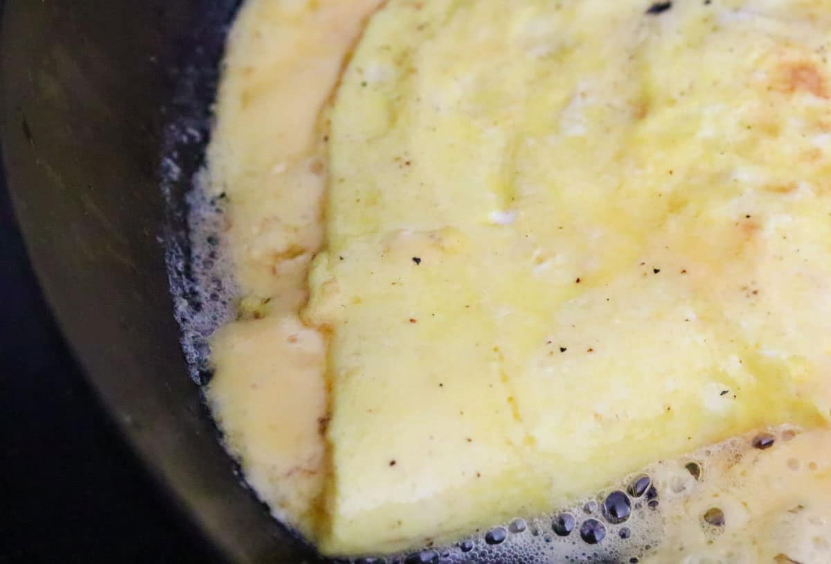 cheesy eggs in a skillet