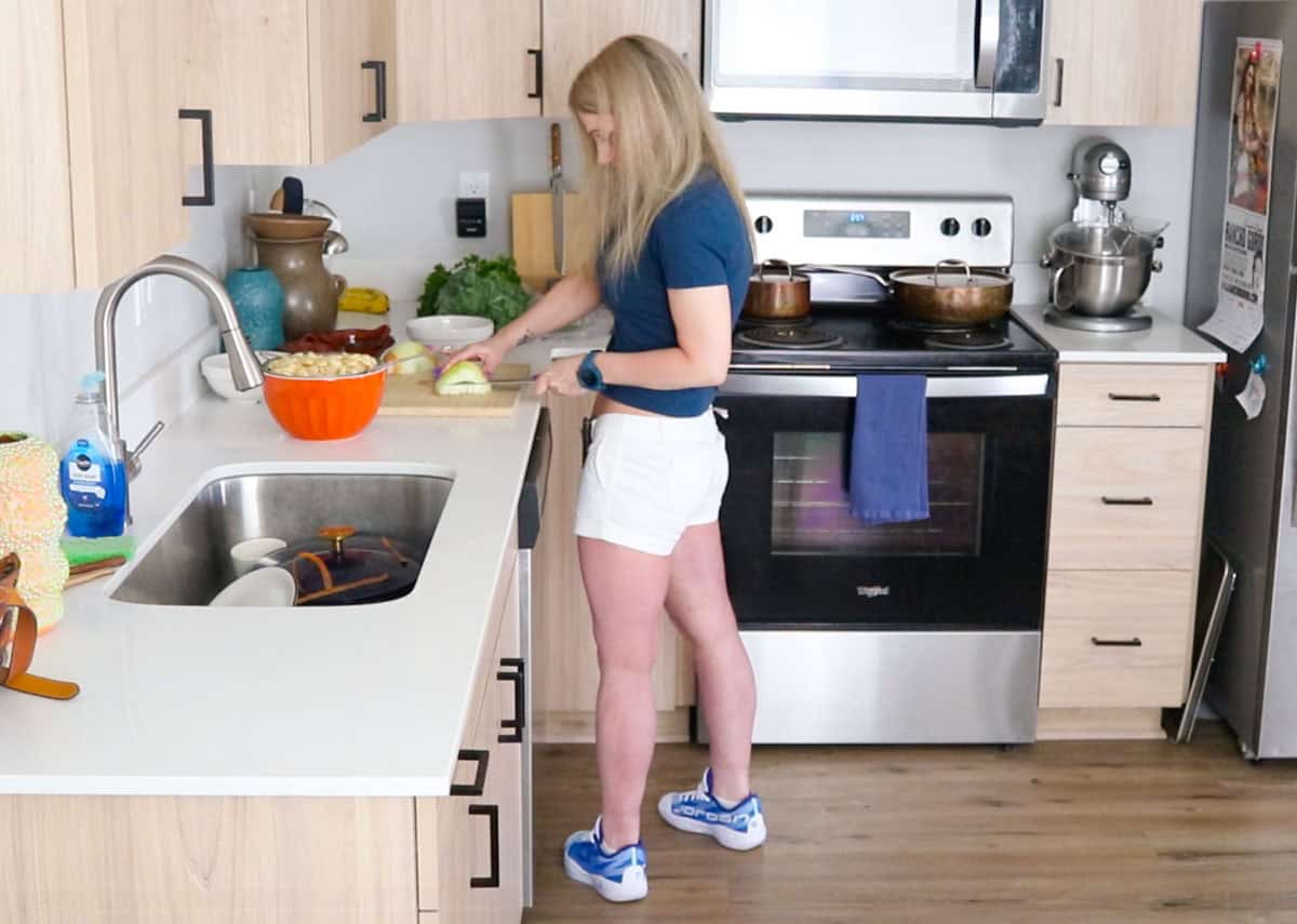 Kristin is chopping an onion