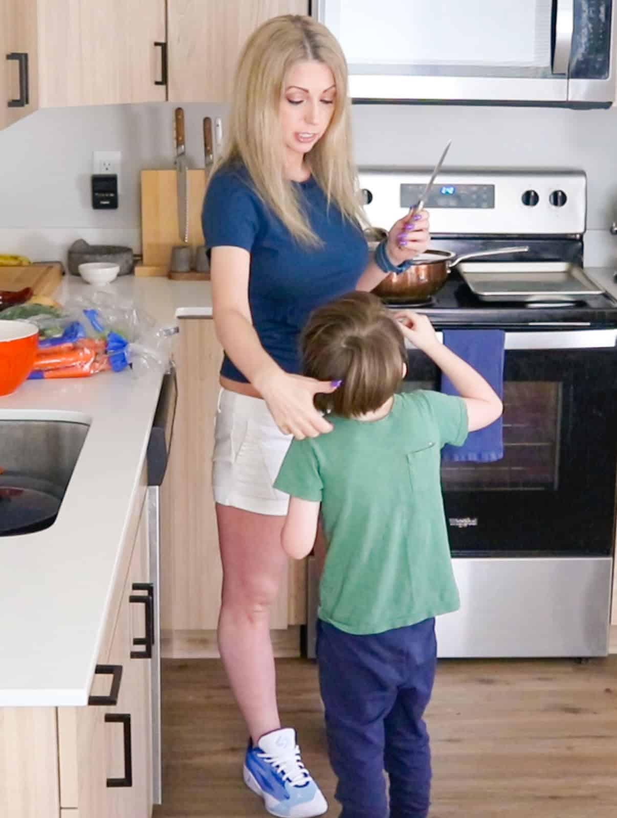 Kristin is talking knife safety with John