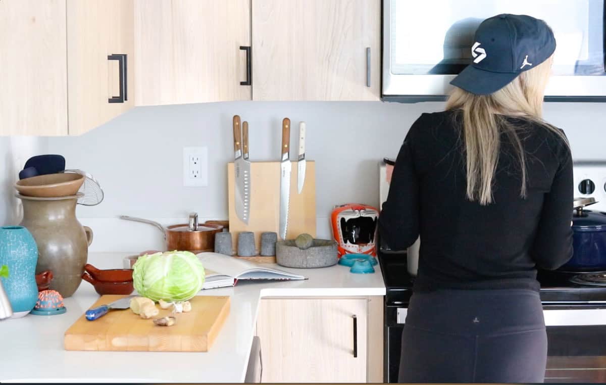 Kristin is talking to the kids from the stove