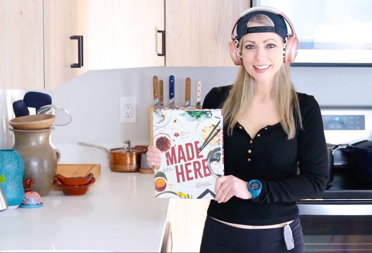 Kristin is holding Made Here cookbook