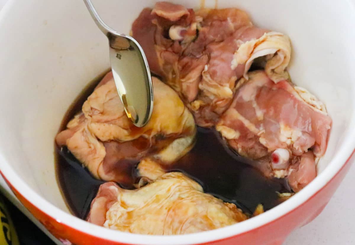 chicken thighs in a soy sauce, wine, and fish sauce marinade