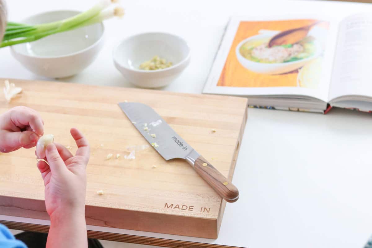Noah is peeling garlic