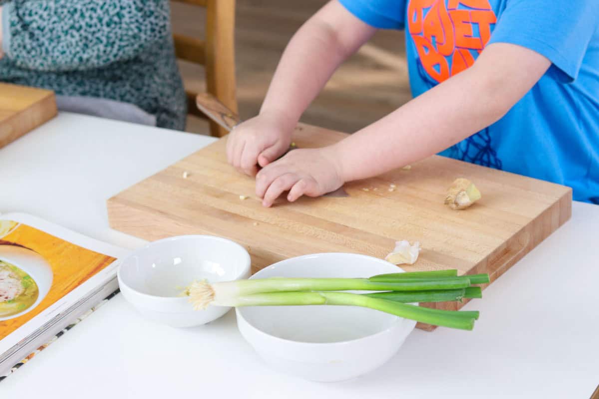 Noah is crushing garlic