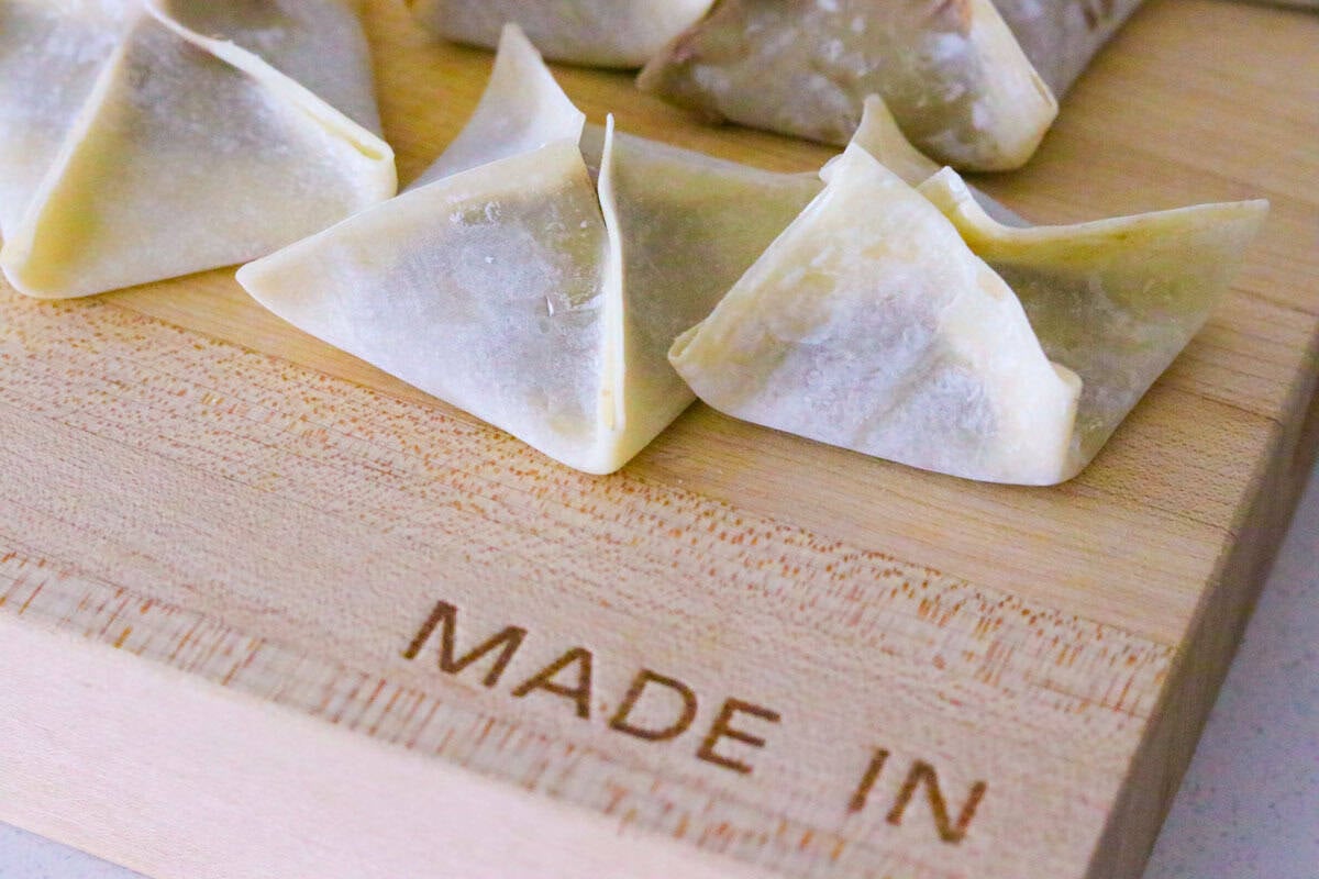 cake rangoons on a butcher block
