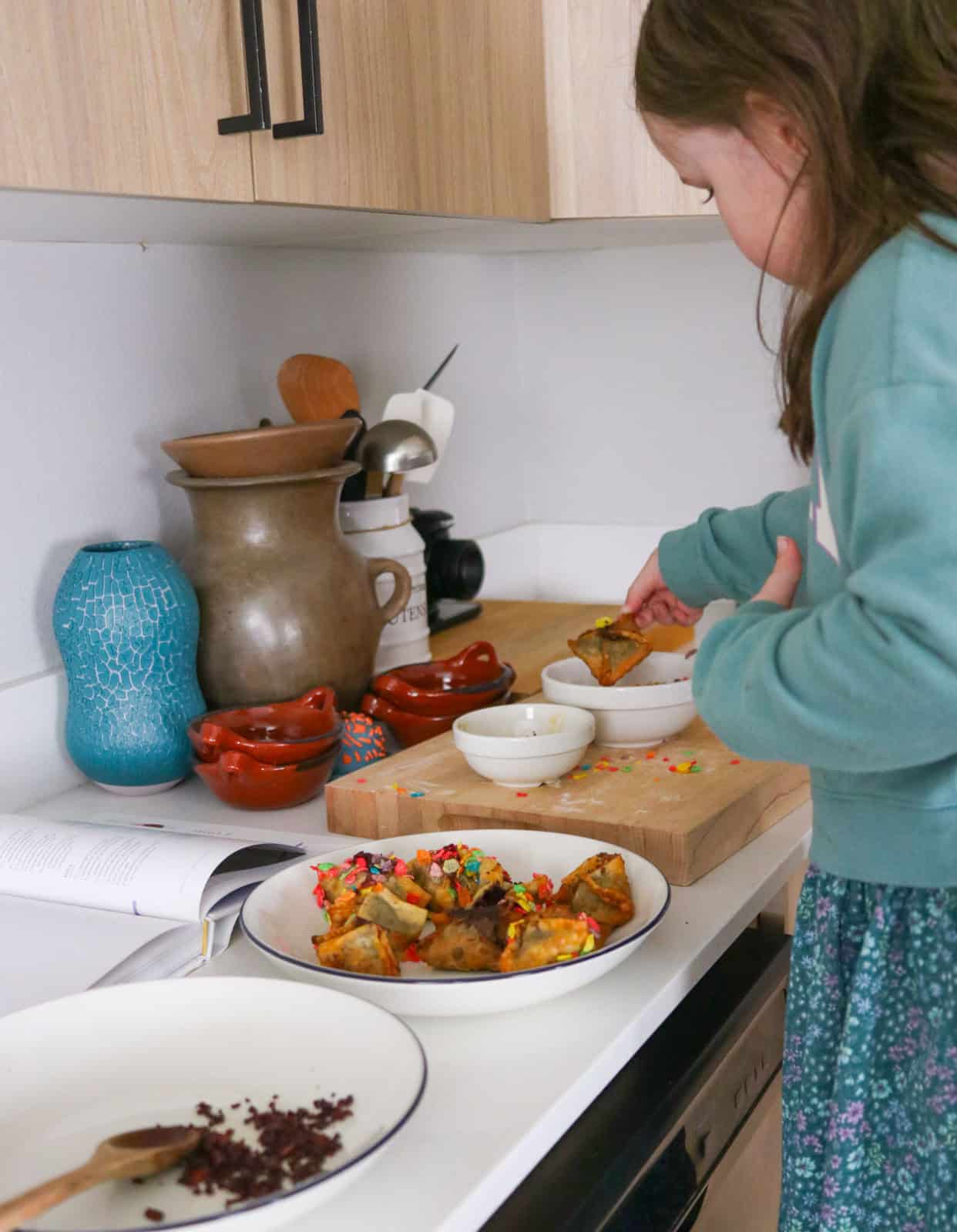 Katalina is dipping a rangoon in Fruity Pebbles