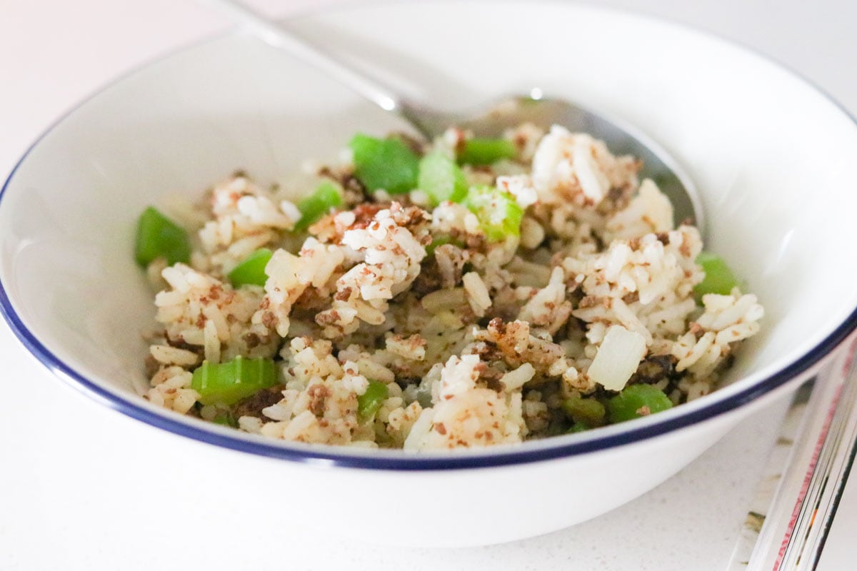 dirty fried rice in a bowl with a spoon
