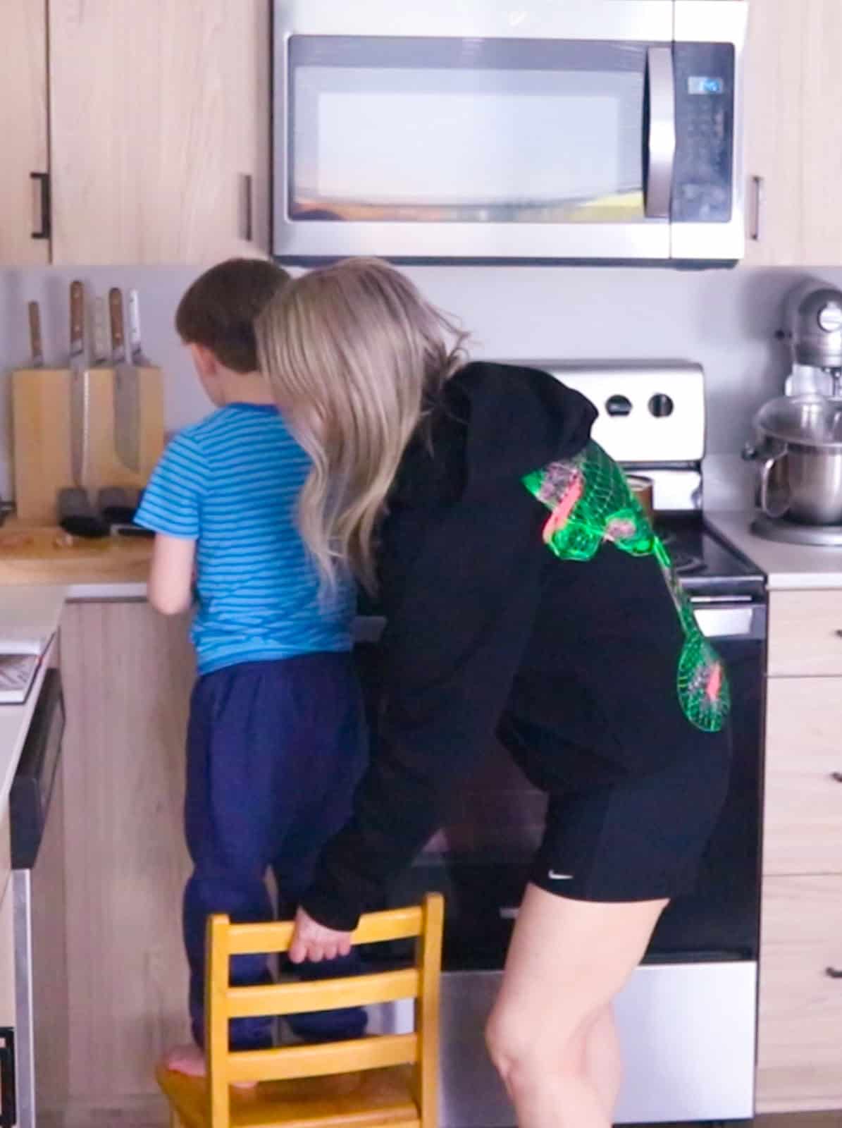 Kristin is helping John get set up at the stove