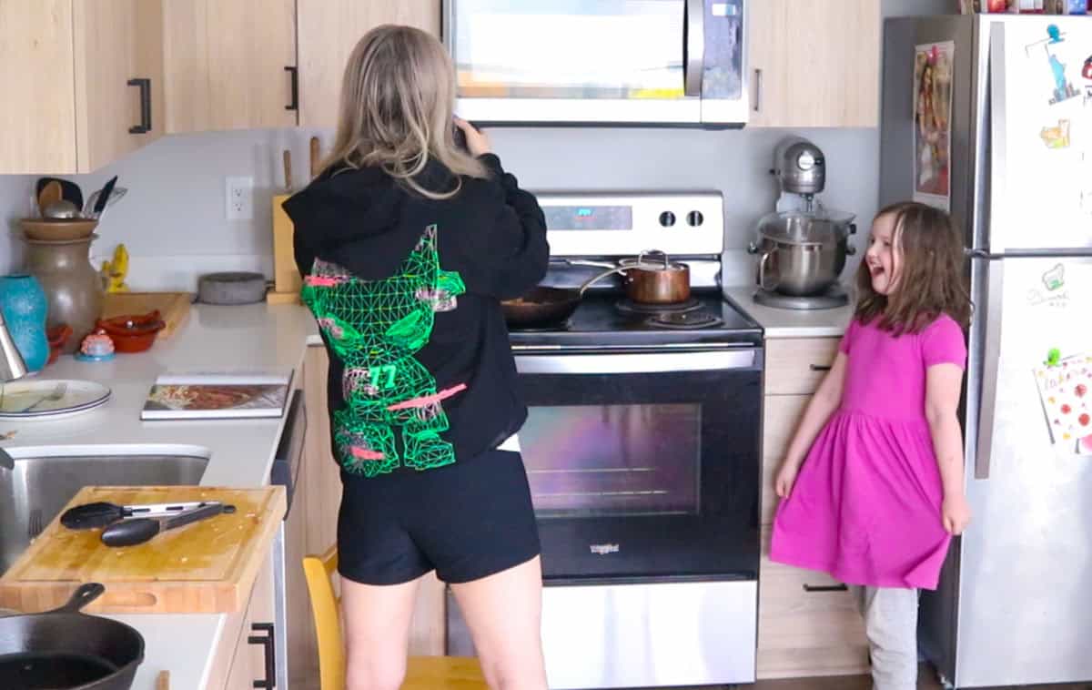 Katalina is performing a curtsy after cooking
