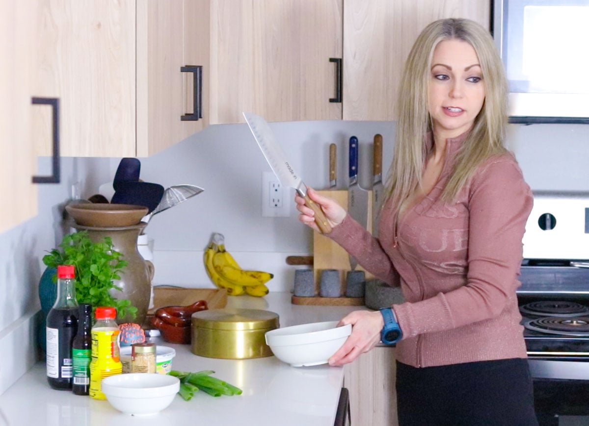 Kristin is grabbing Noah a knife for cutting brussels sprouts