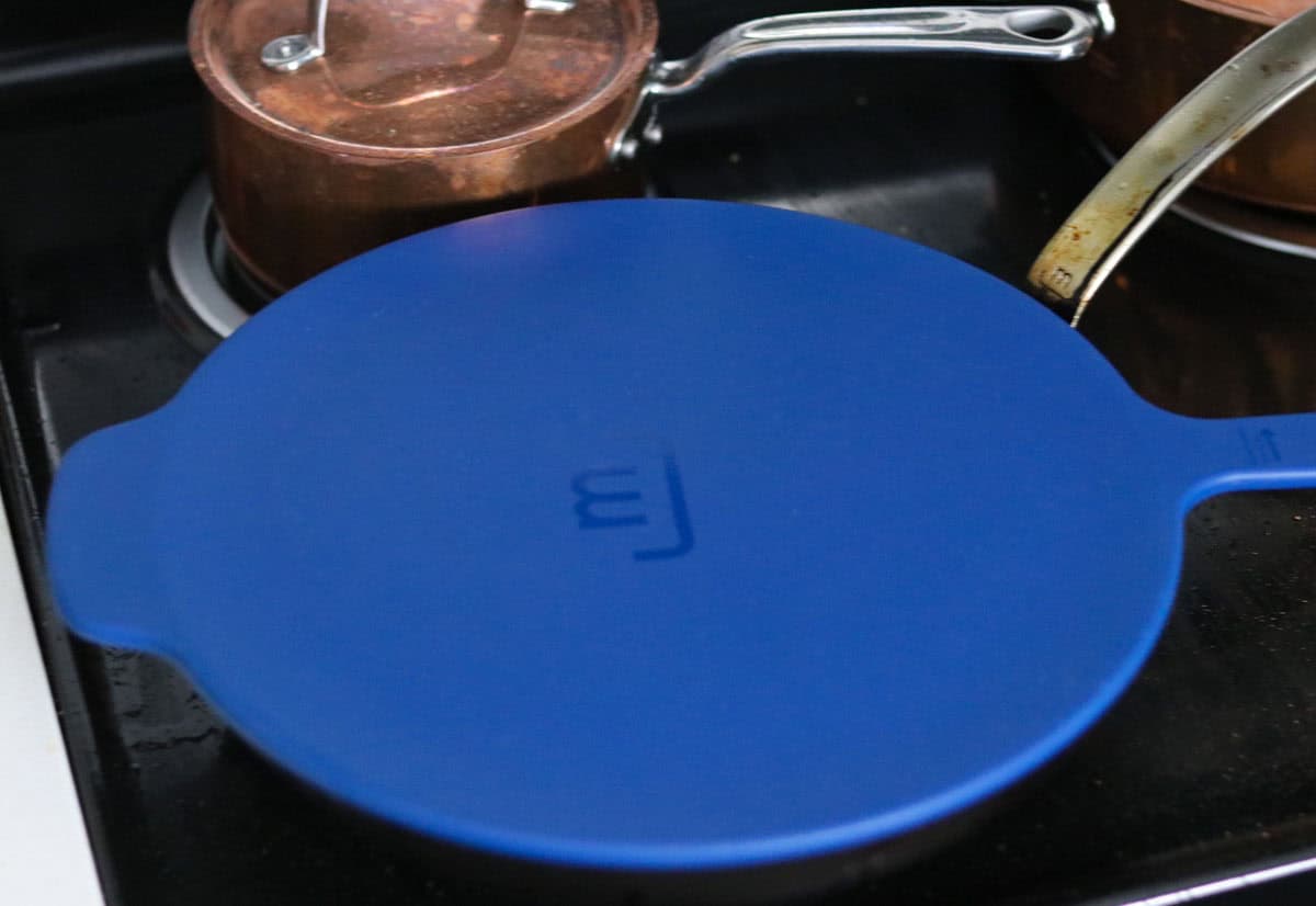 Made In carbon steel pan with a pan cover on the stove