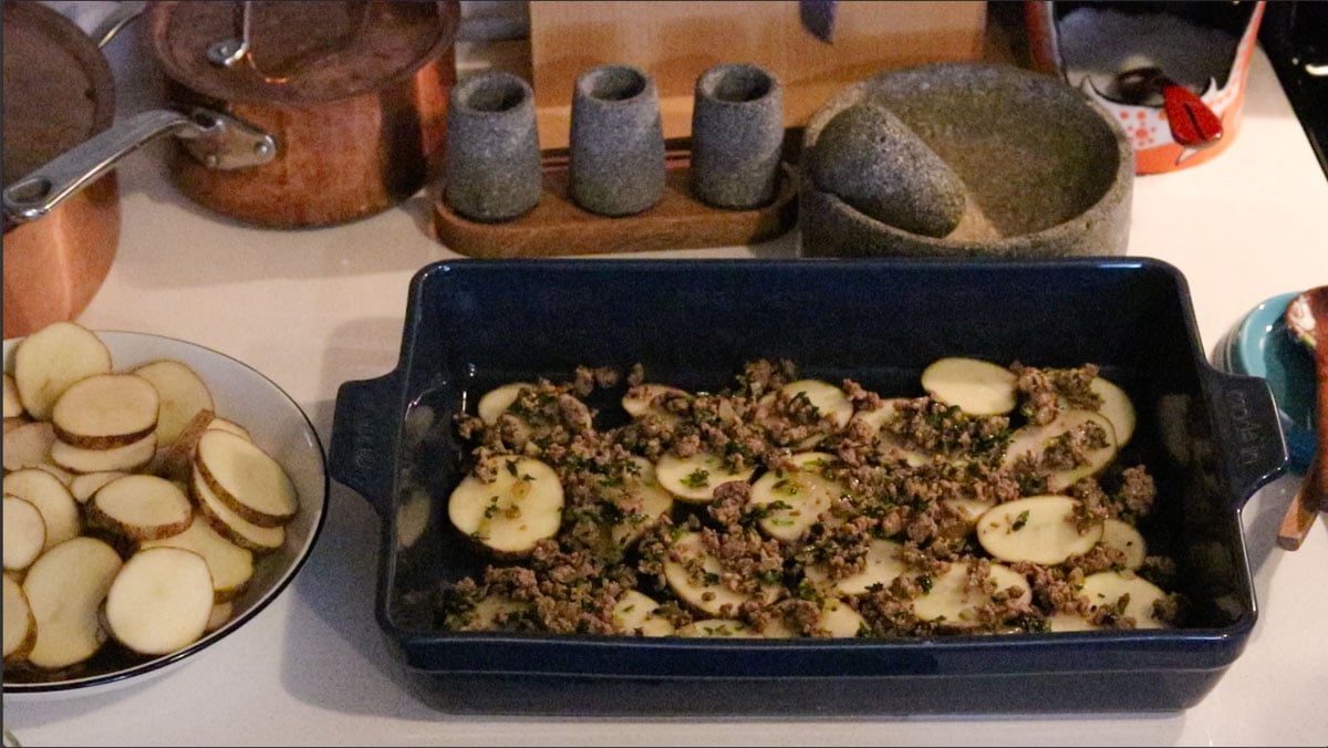 potatoes and ground lamb in a baking dish