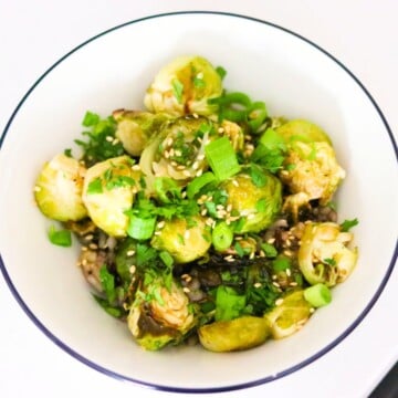 sweet and sticky brussels sprouts in a bowl with wild rice
