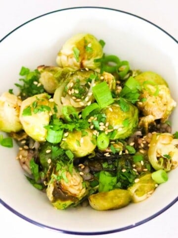 sweet and sticky brussels sprouts in a bowl with wild rice