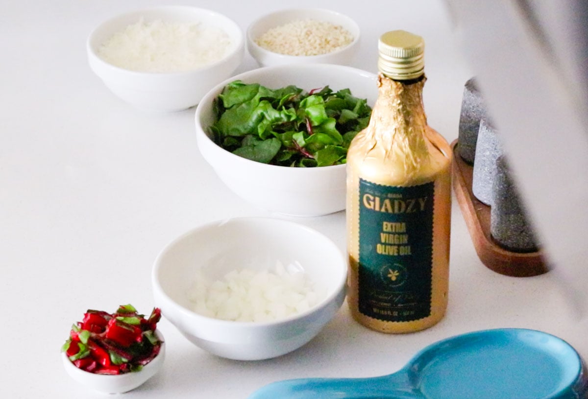 Giadzy extra-virgin olive oil beside braciole filling ingredients