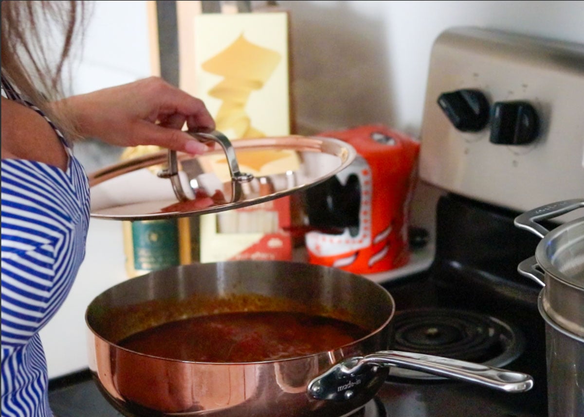 Kristin is checking on the beef braciole