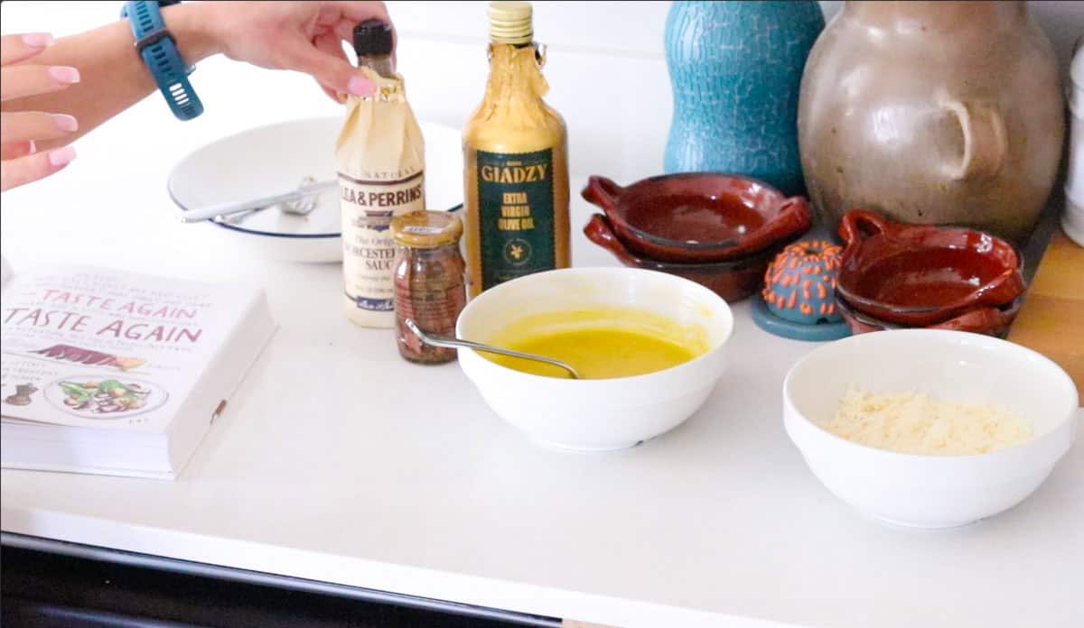 Kristin is grabbing the Worcestershire sauce
