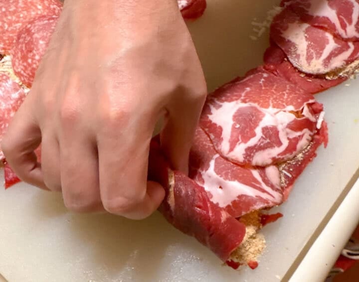 rolling up braciole