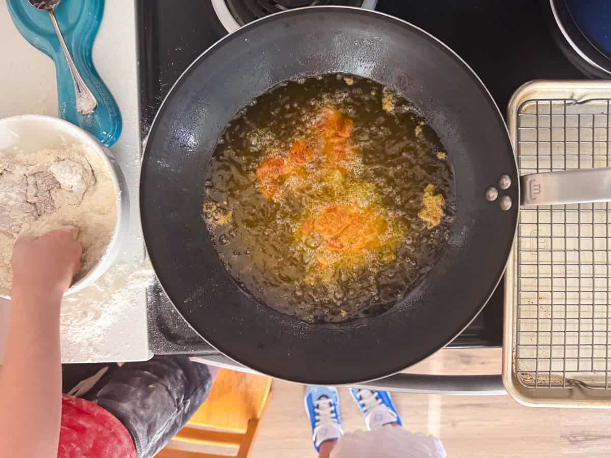 chicken frying in a wok