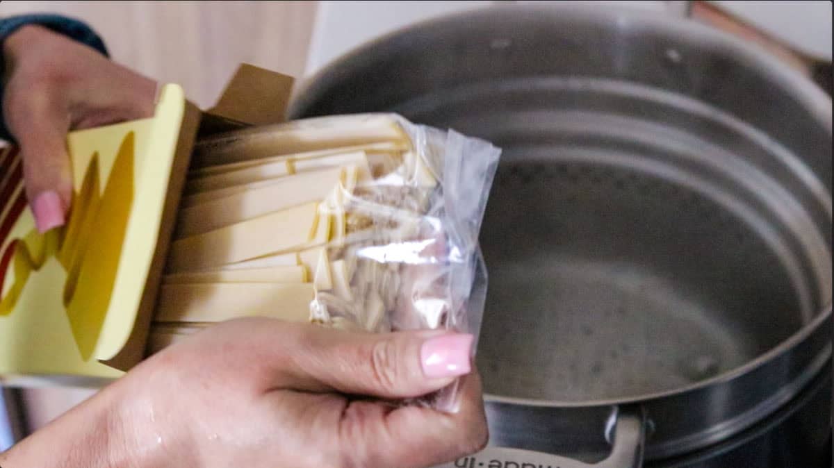 Kristin is opening a package of Giadzy pappardelle pasta