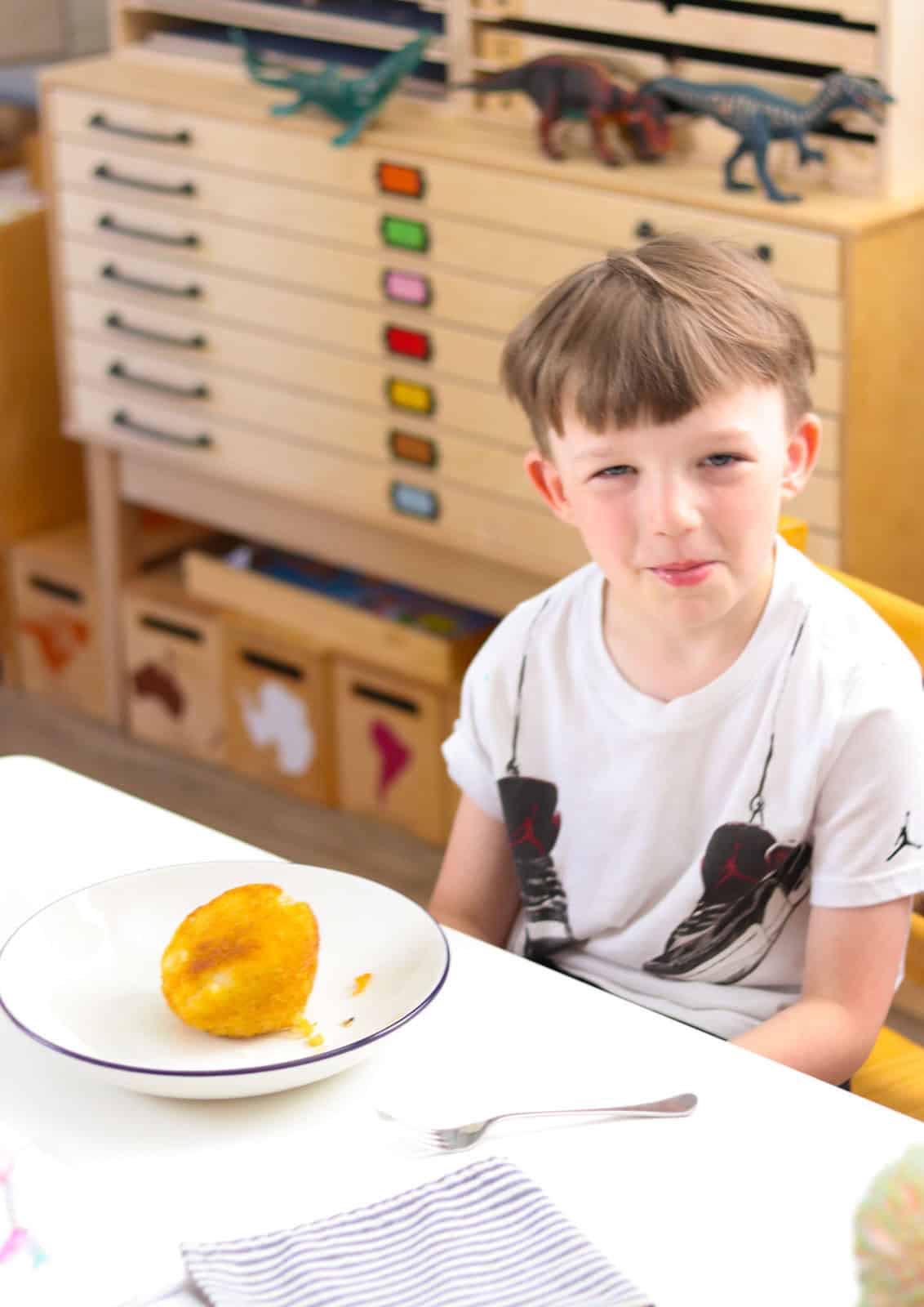 John is eating papas rellenas for the first time