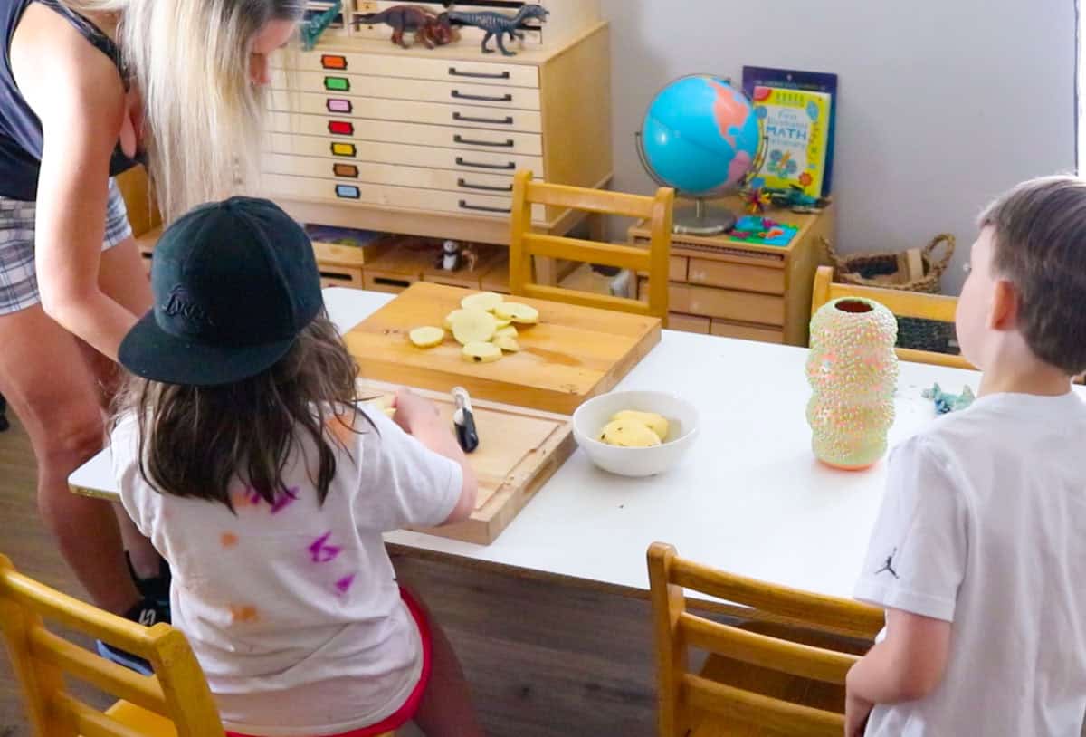 Kristin is showing Katalina how to slice potatoes into rounds and cubes
