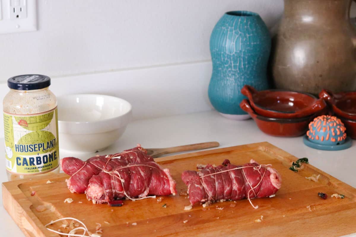 beef braciole on a butcher block