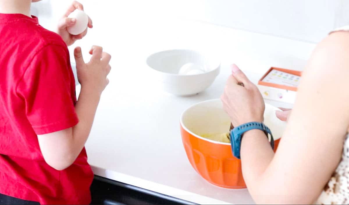 John and Kristin are mxiing eggs into the pastry dough