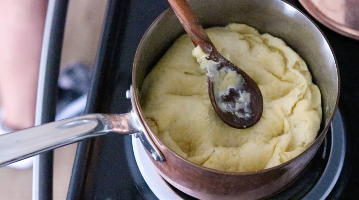 heating choux pastry in a saucepan for zeppole
