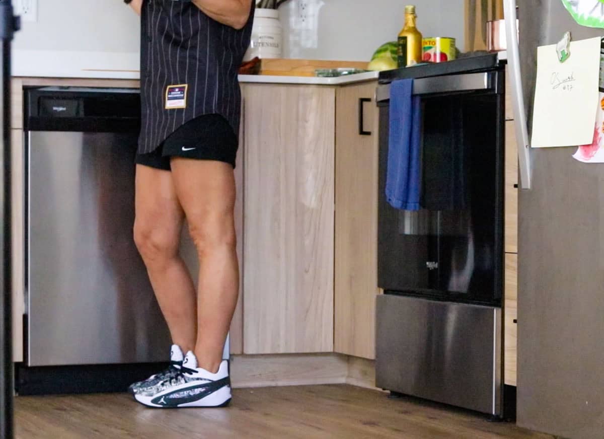 Kristin is in the kitchen and this is a view in front of the stove with pizza sauce ingredients on the counter