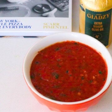 ny pizza sauce beside The Scarr's Pizza Cookbook and Giadzy extra virgin olive oil