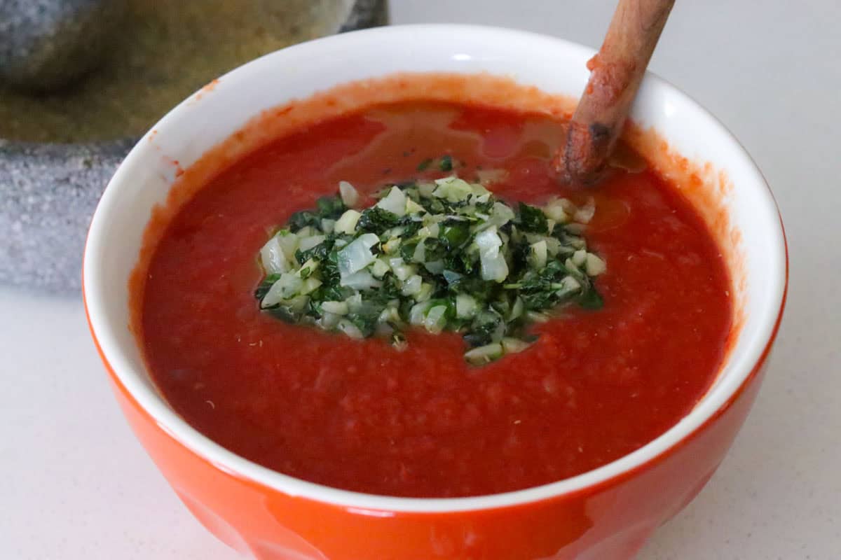cooked onion, garlic, oregano, and basil in a tomato mixture