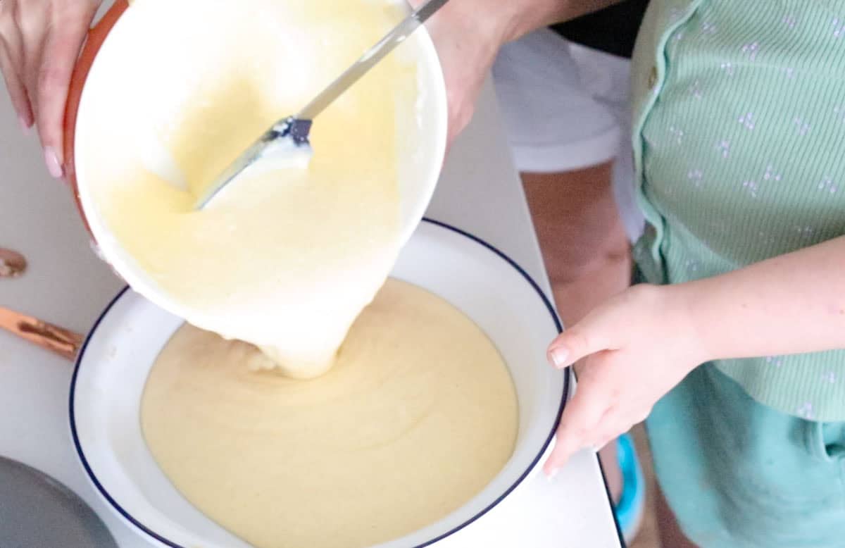Kat is transferring the ricotta timbale to a pie dish