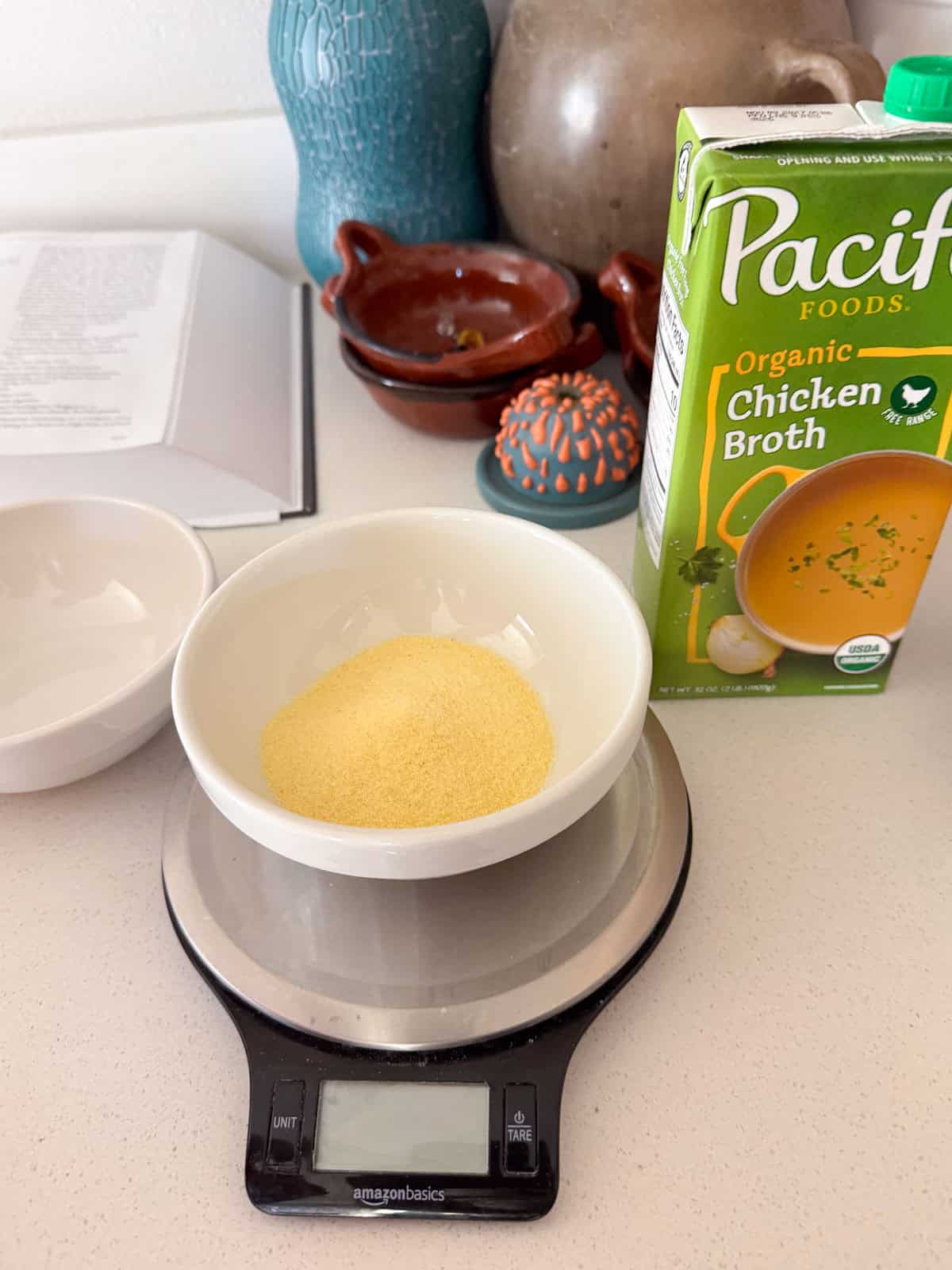 semolina flour in a bowl sitting on a kitchen scale