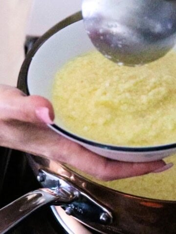 stracciatella is being ladled into a bowl