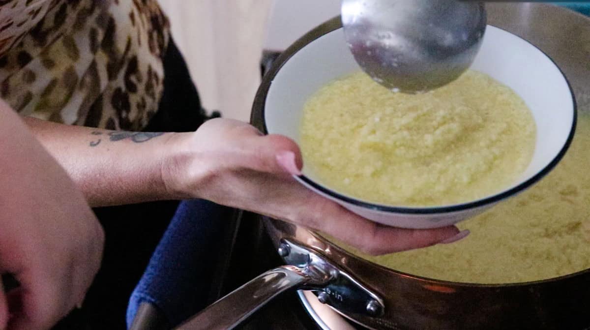Kristin is ladling soup into a bowl