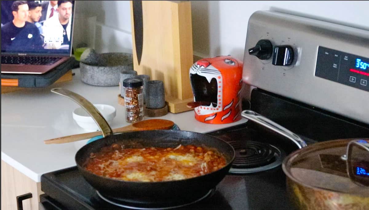 eggs and beans in purgatory in a pan