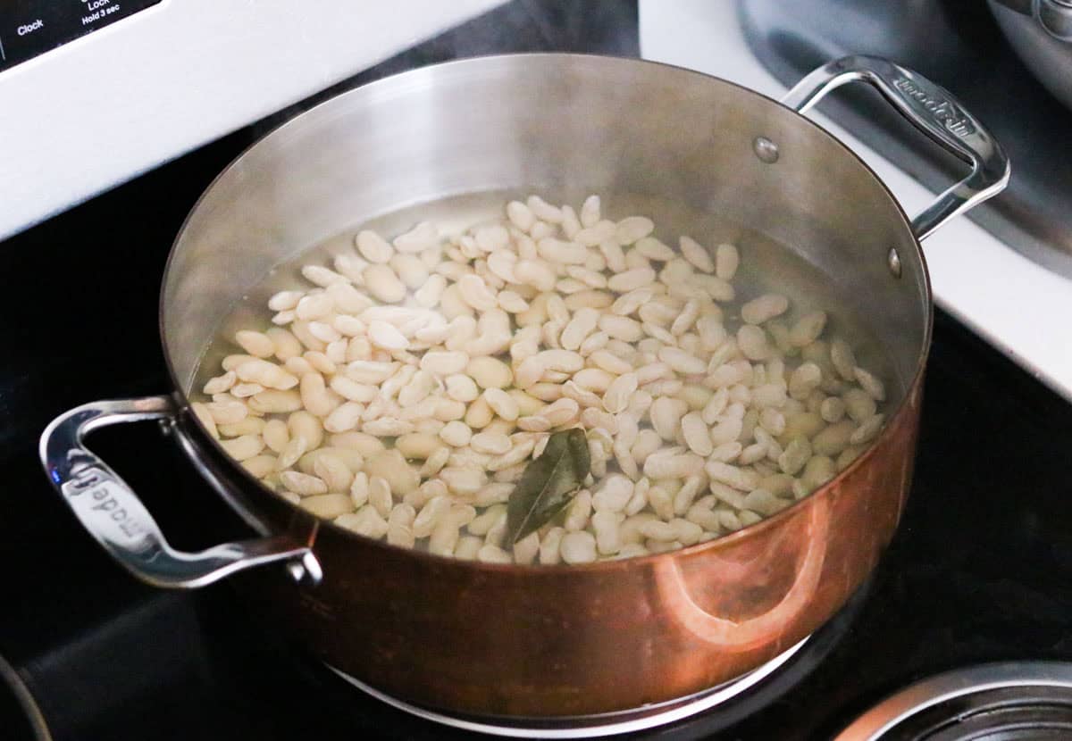 Cassoulet beans cooking in a saucier 