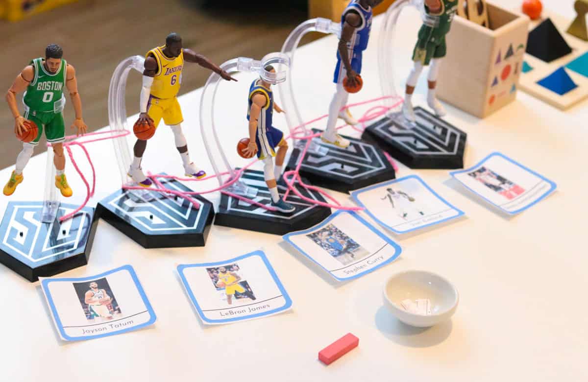 Hasbro Starting Lineup NBA action figures, matching cards, and a conjunction grammar symbol