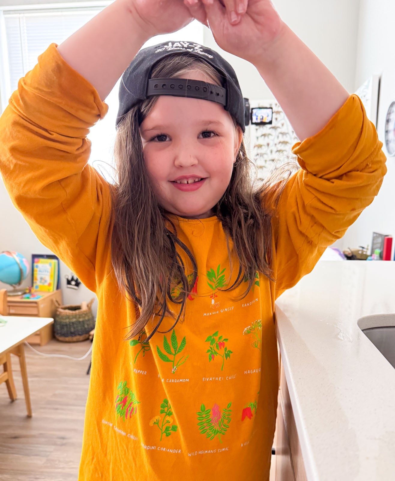 kat is showing off her Diaspora Co. shirt