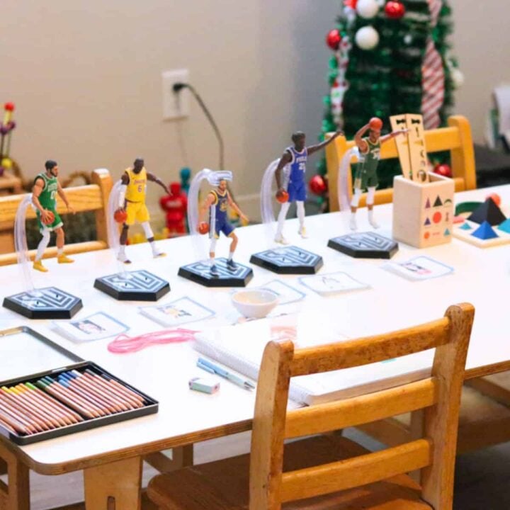 nba action figures, colored pencils, and Montessori grammar symbols on a table