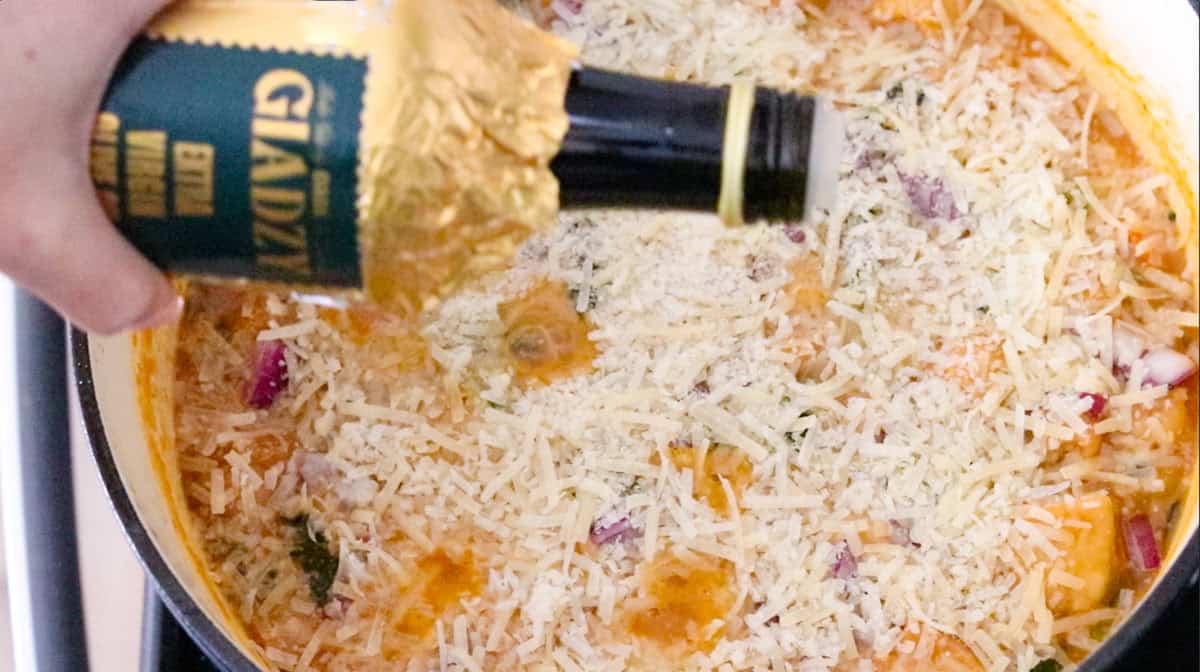 Giadzy olive oil over a Dutch oven with ribollita ingredients