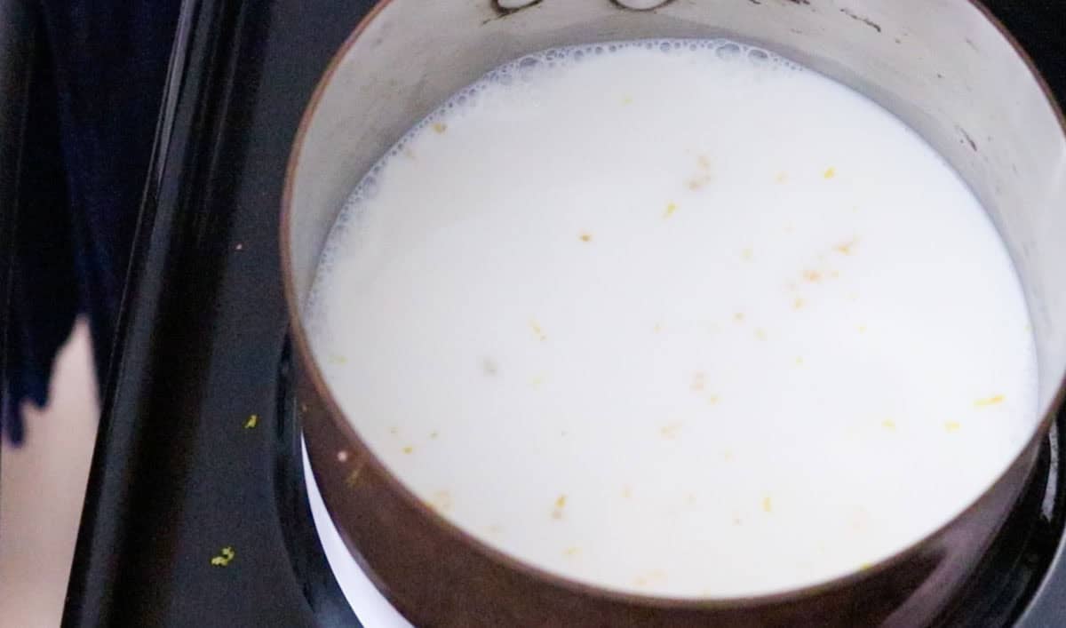 milk and lemon zest in a saucepan on the stove