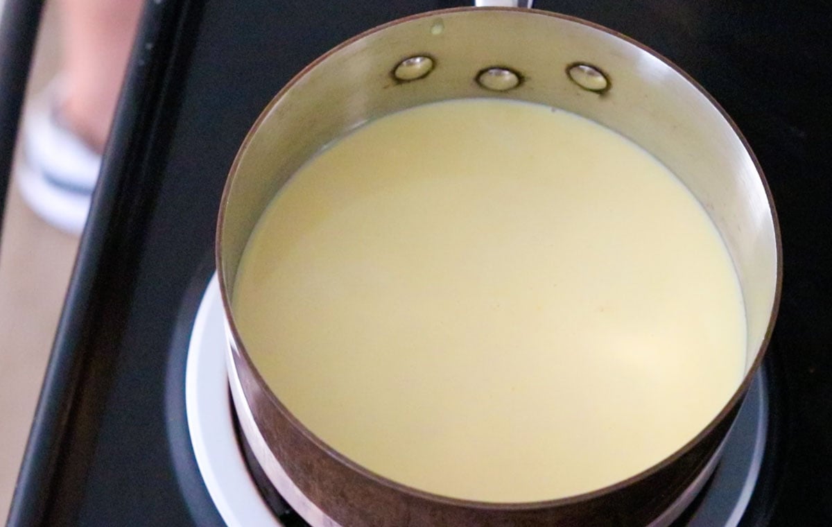 heating confectioners custard in a saucepan on the stove