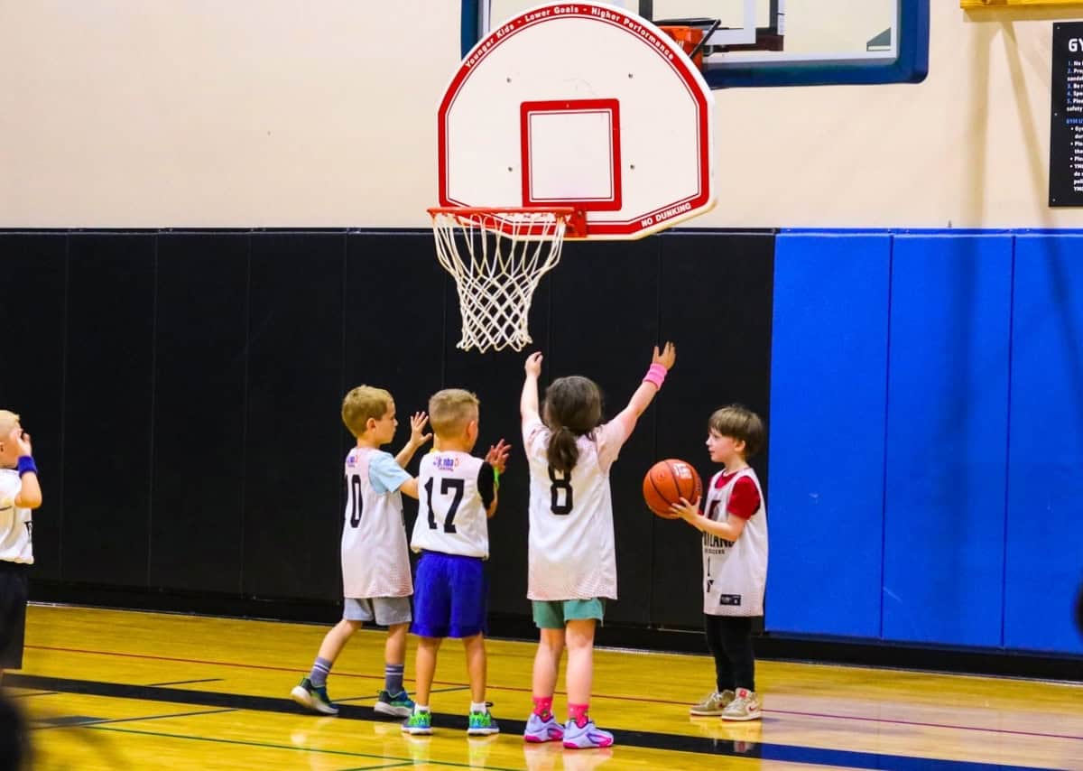 Kat and John playing in a Jr. NBA/YMCA youth basketball game