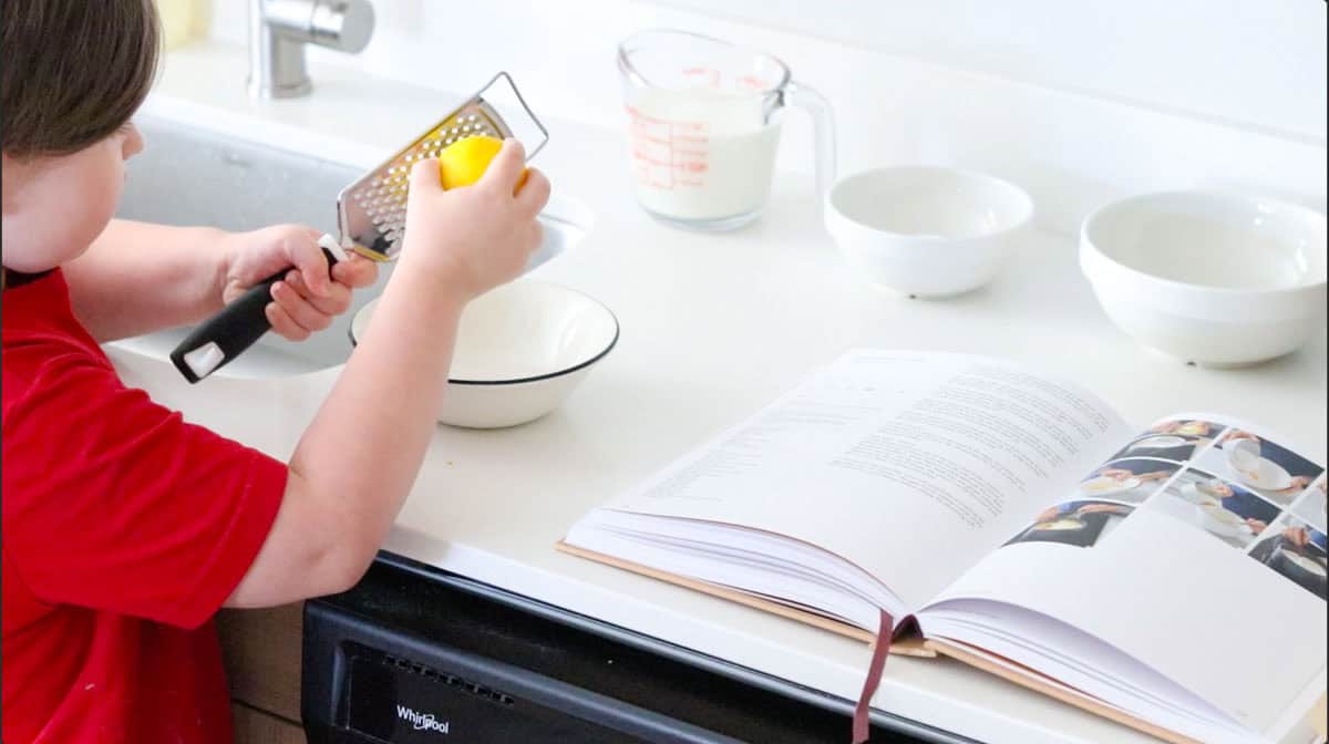 Kat is zesting lemon into a bowl