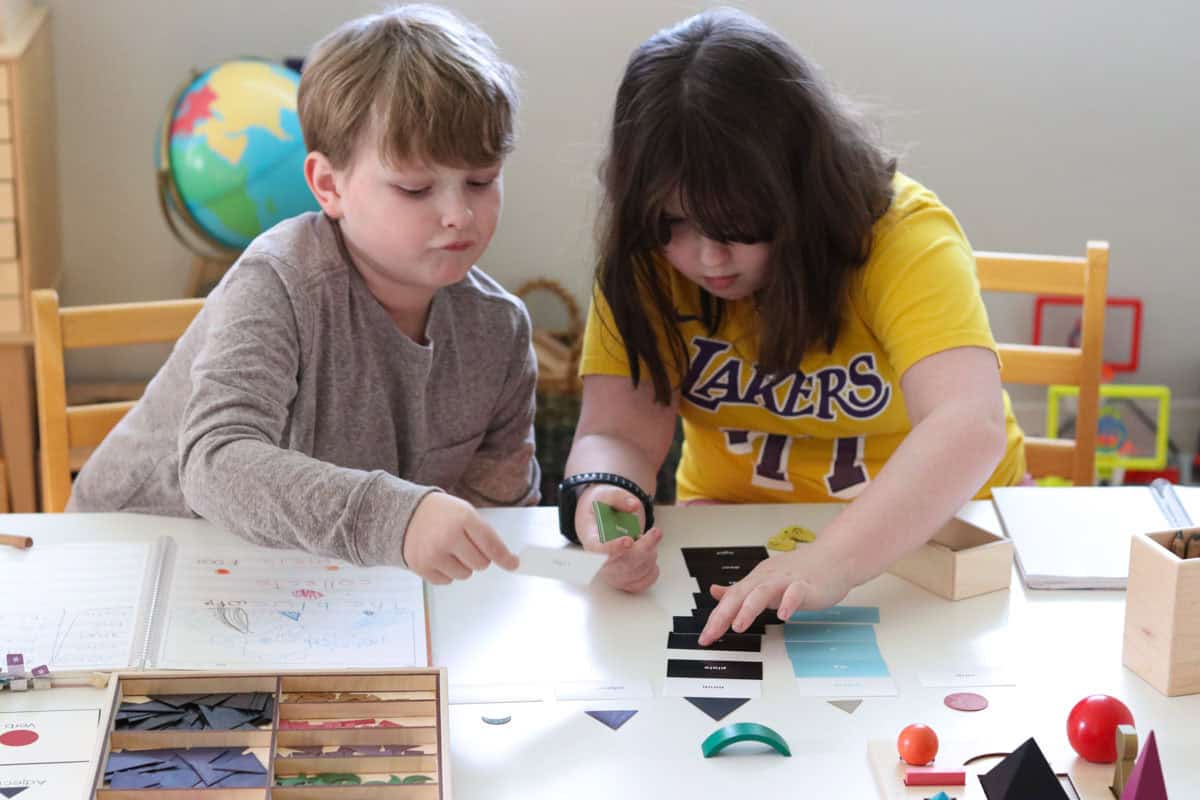 Kaia and Noah are working on their prepositions lesson