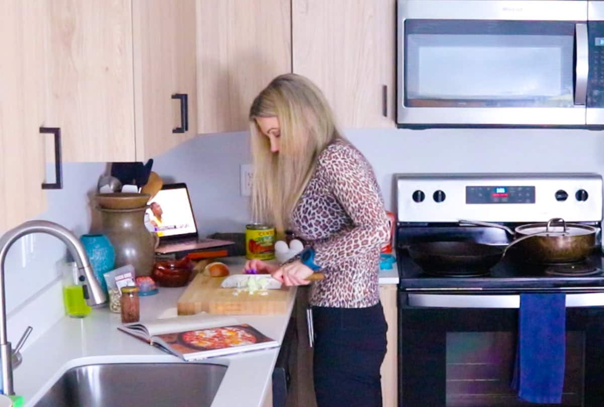 Kristin is chopping an onion