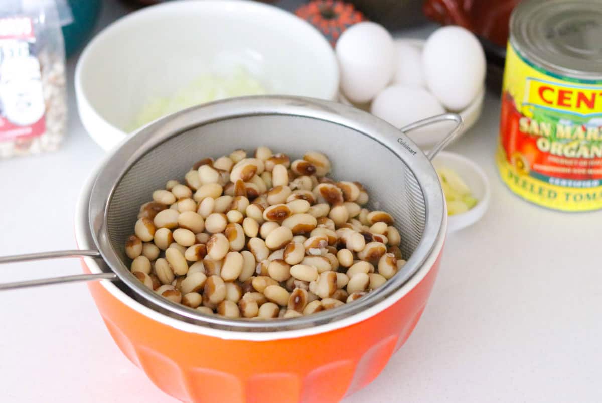 cooked yellow eye beans in a strainer