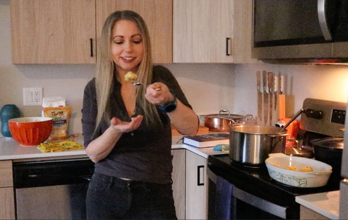Kristin is tasting the corn dumplings right out of the stock pot